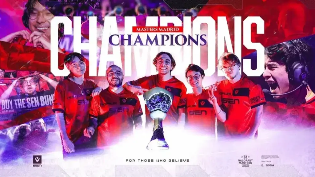 Five esports players in red jerseys celebrate with a trophy, labeled 'Masters Madrid Champions'.