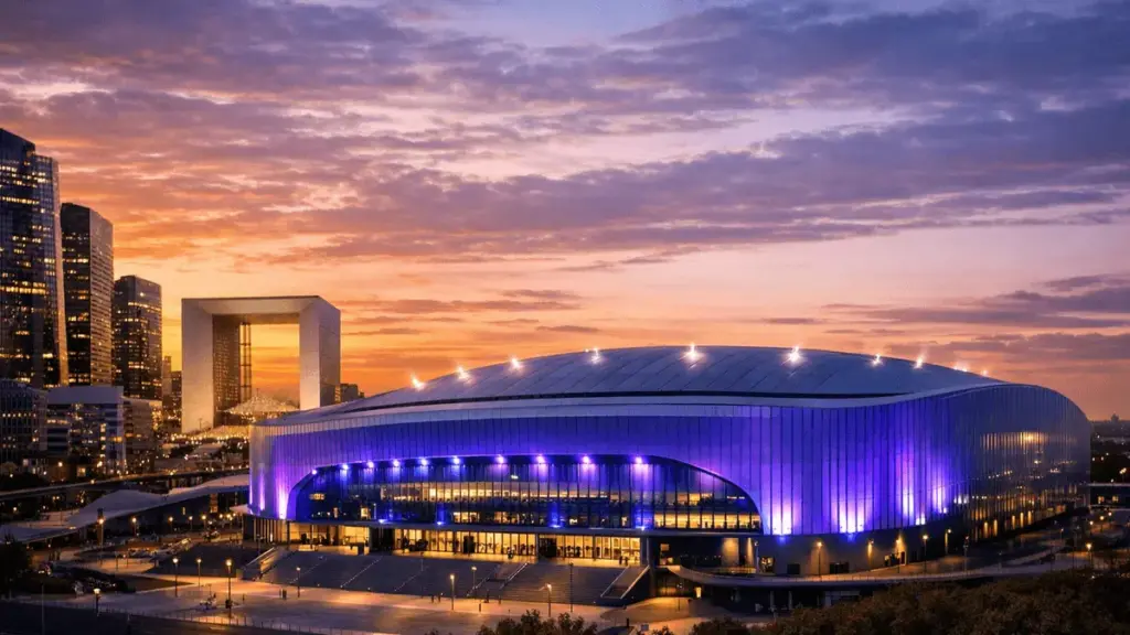 Paris La Défense Arena illuminated for major esports event at sunset