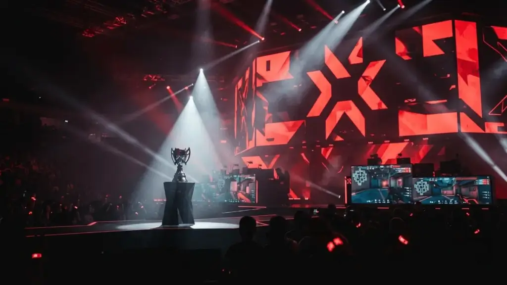 100 Thieves championship victory at Valorant EWC 2026 tournament with dramatic arena lighting