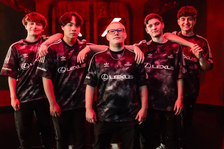 Five members of the 100 Thieves Valorant team posing in jerseys.