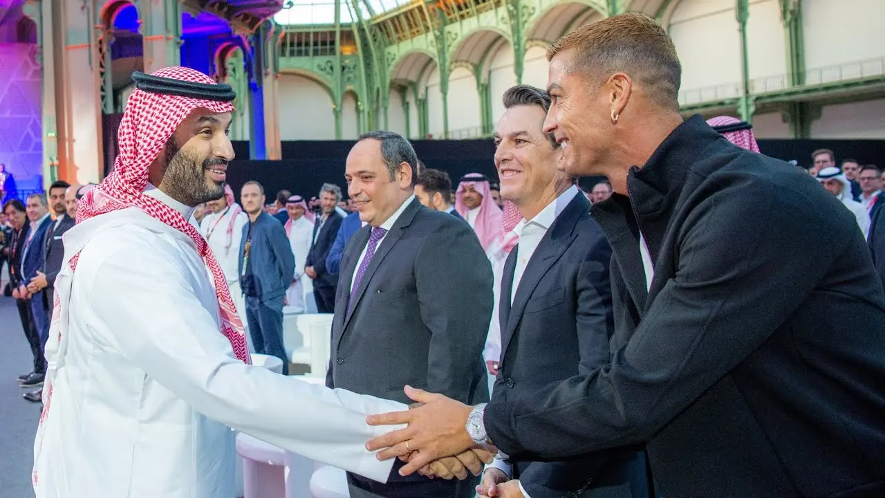 Cristiano Ronaldo shaking hands with Crown Prince Mohammed bin Salman at an event in Paris