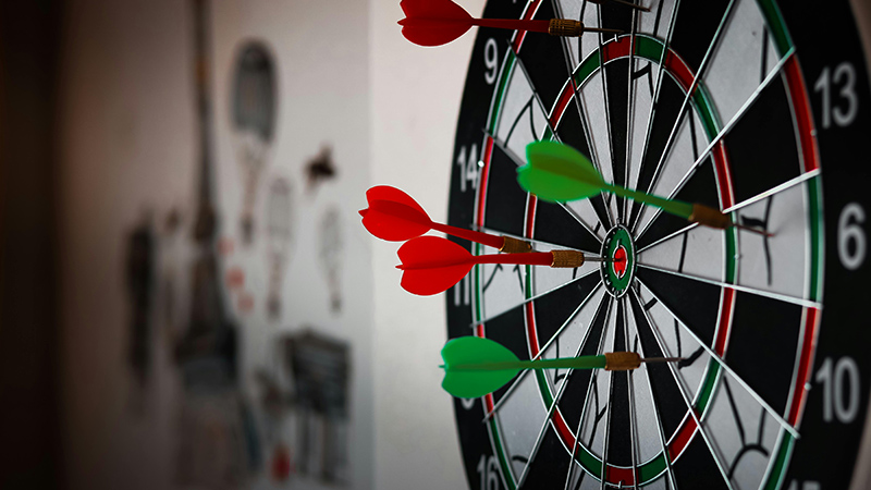 photo of darts embedded in a dartboard