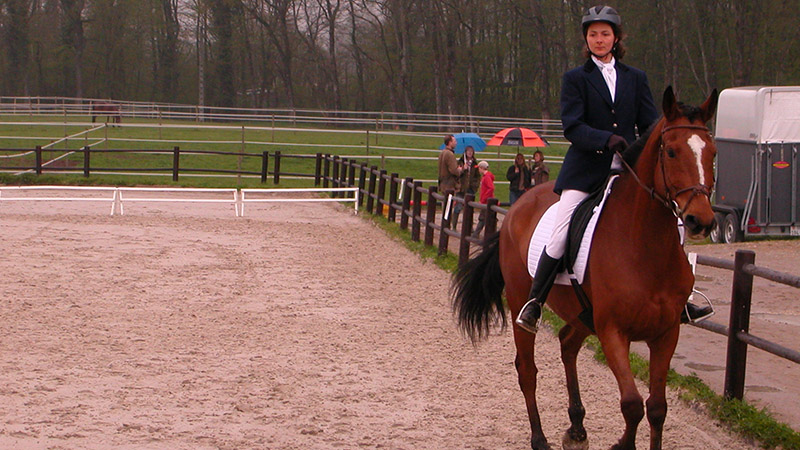 photo showing a person riding a horse
