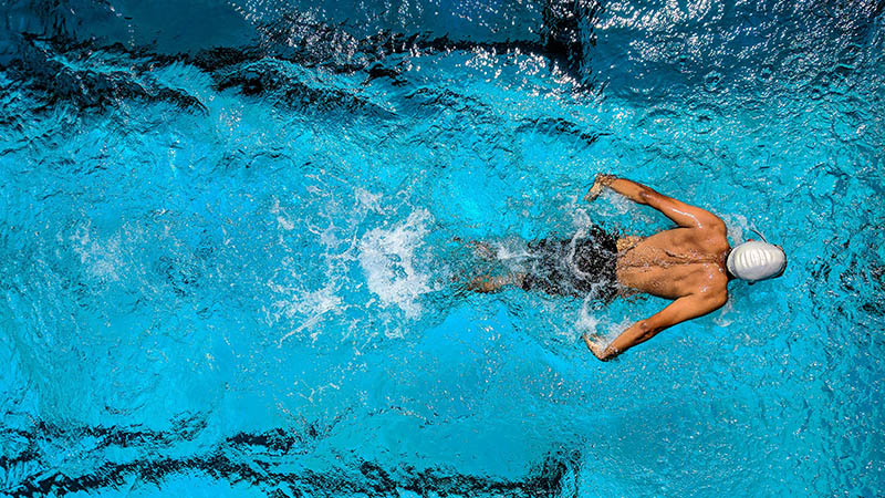 photo of a person swimming in a swimming pool