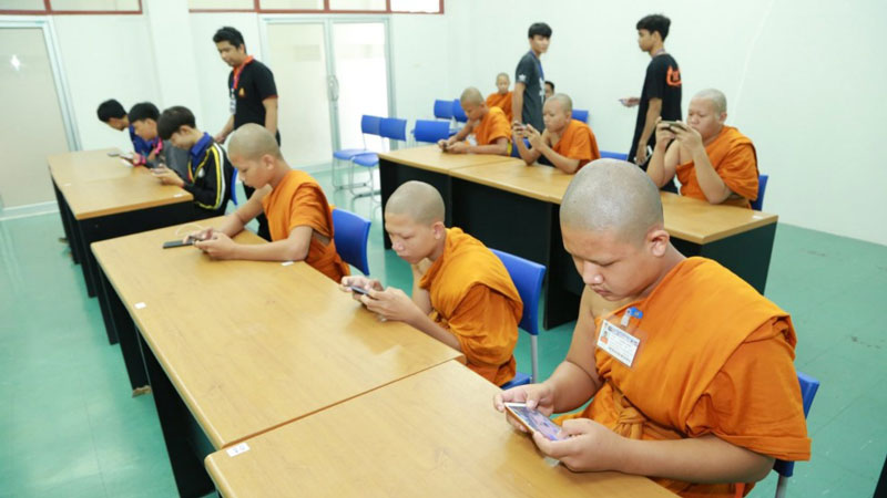 Monks playing in esports tournament