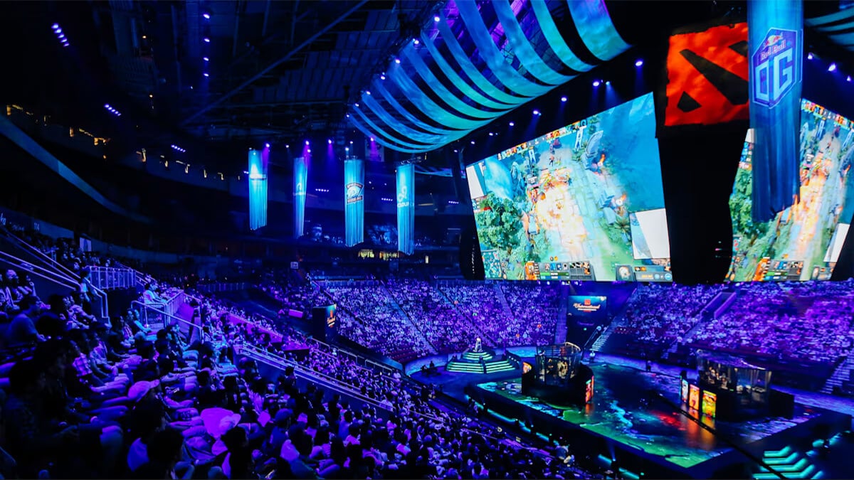 gathered crowd in an esports arena watching the international tournament