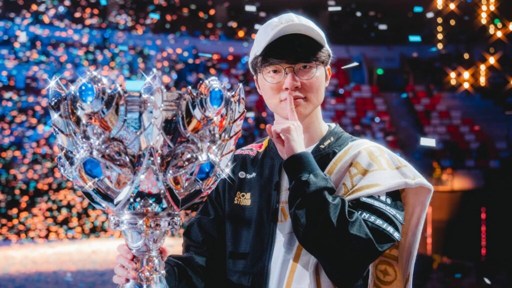 Player holding a large trophy amid celebratory lights at an LCK event