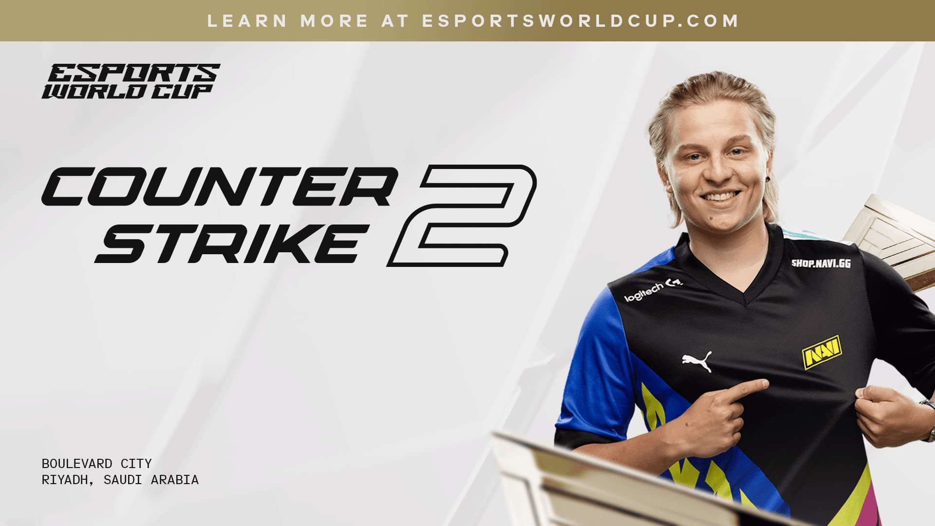 An esports athlete in a black and blue jersey promoting Counter Strike 2 at the Esports World Cup in Riyadh, Saudi Arabia.