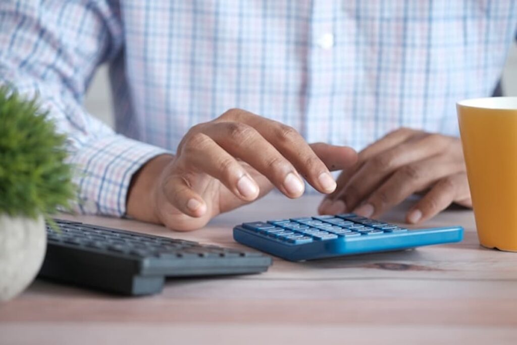 Man with Calculator and Keyboard