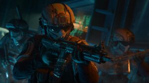 Three soldiers of COD in futuristic armor and helmets cautiously move through a dimly lit room, holding rifles