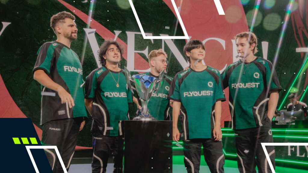 Five esports team members in matching green FlyQuest jerseys stand proudly on a stage, focused on a shiny trophy