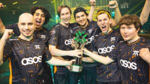 Fnatic roster celebrating with the Masters trophy on stage