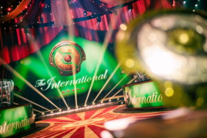 The International esports stage with Aegis of Champions logo