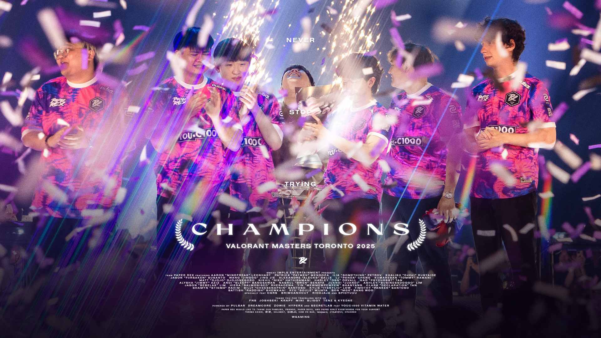 A team of six people in vibrant eSports jerseys celebrate their victory on stage, surrounded by confetti and lights, conveying excitement and achievement.