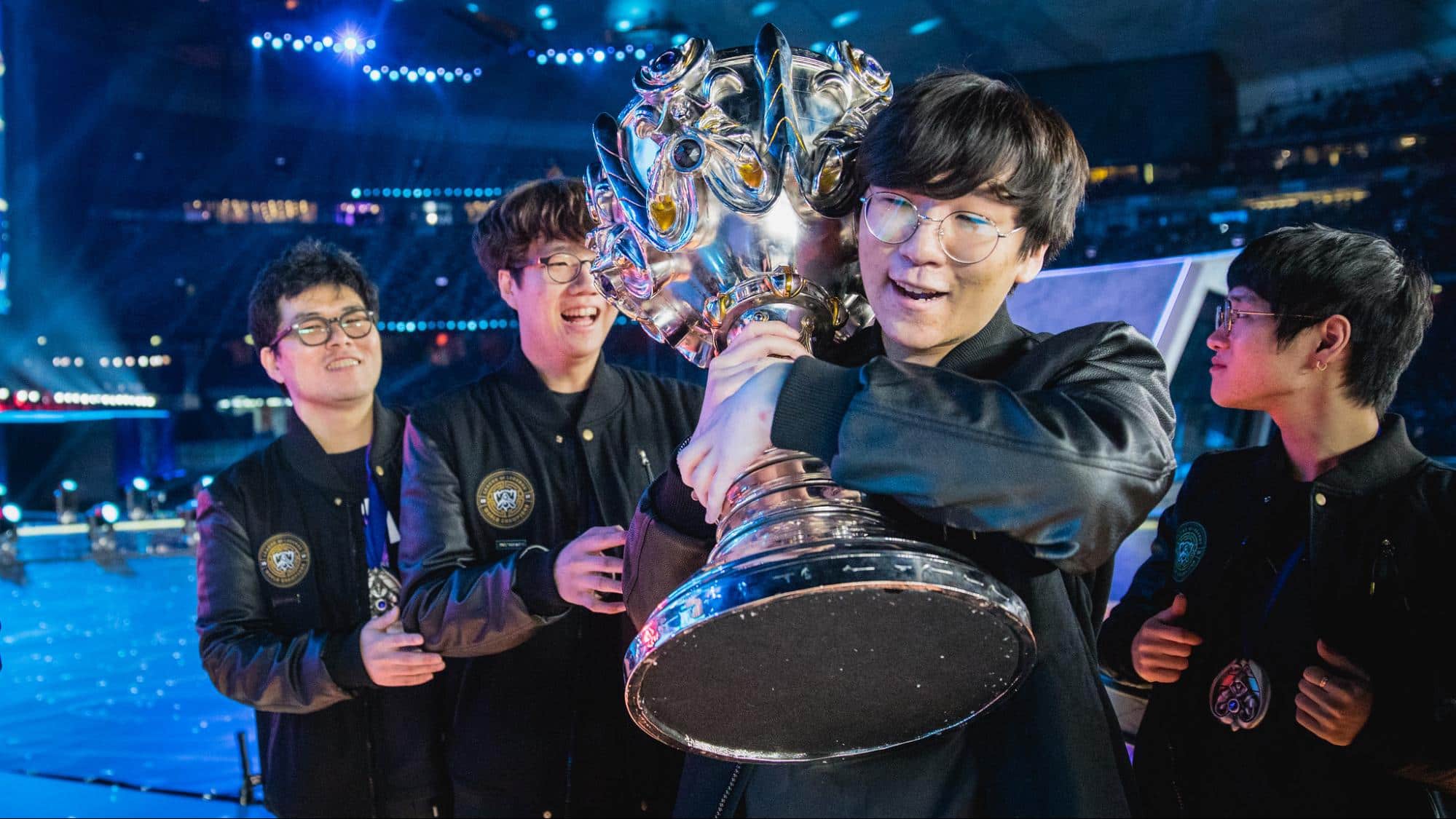 Korean team celebrating with Summoner’s Cup on stage