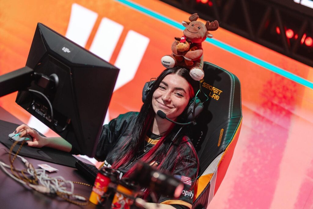 Alexis alexis Guarrasi smiling during VALORANT esports match with plush toy on headset