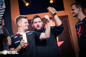 Astralis players celebrate with gold bars after winning the first Intel Grand Slam in Counter-Strike