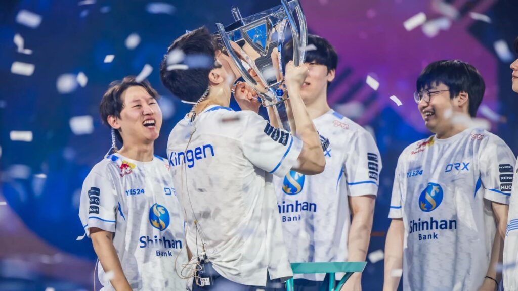 DRX celebrating their League of Legends Worlds 2022 championship with the trophy