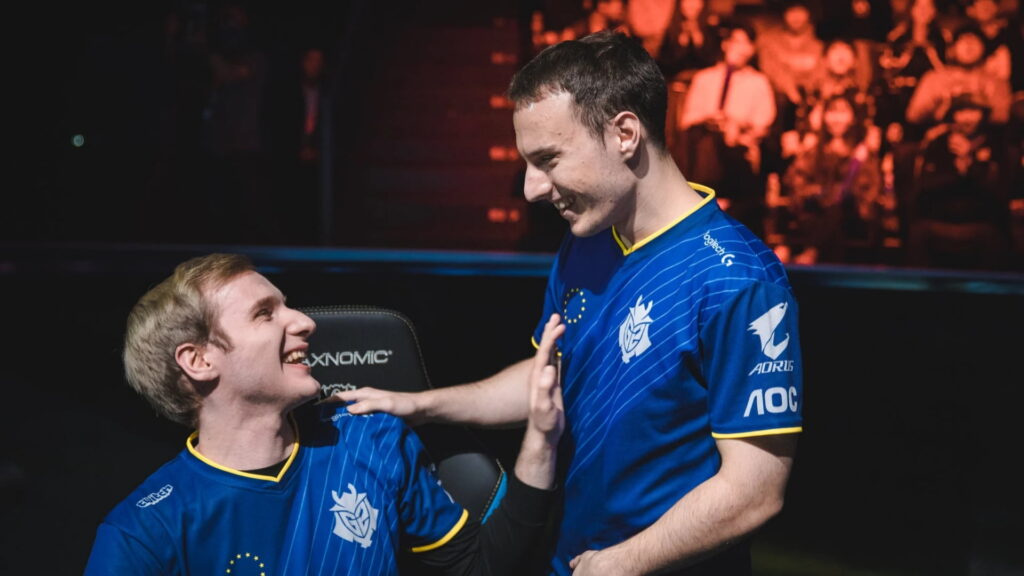 G2 Esports players celebrating during a League of Legends Worlds match