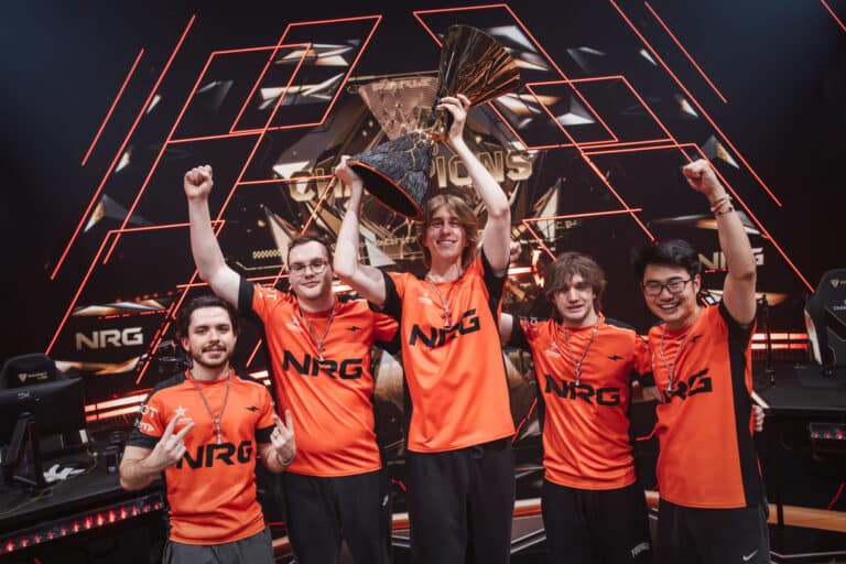 NRG players celebrate with the trophy after winning the VALORANT Champions tournament
