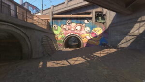 The graffiti-covered monster tunnel area on Overpass in Counter-Strike 2 Active Duty map pool