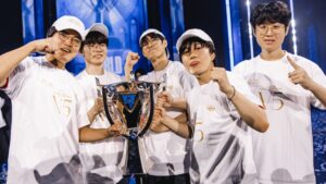T1 League of Legends players celebrating with the Worlds trophy after winning the 2024 championship