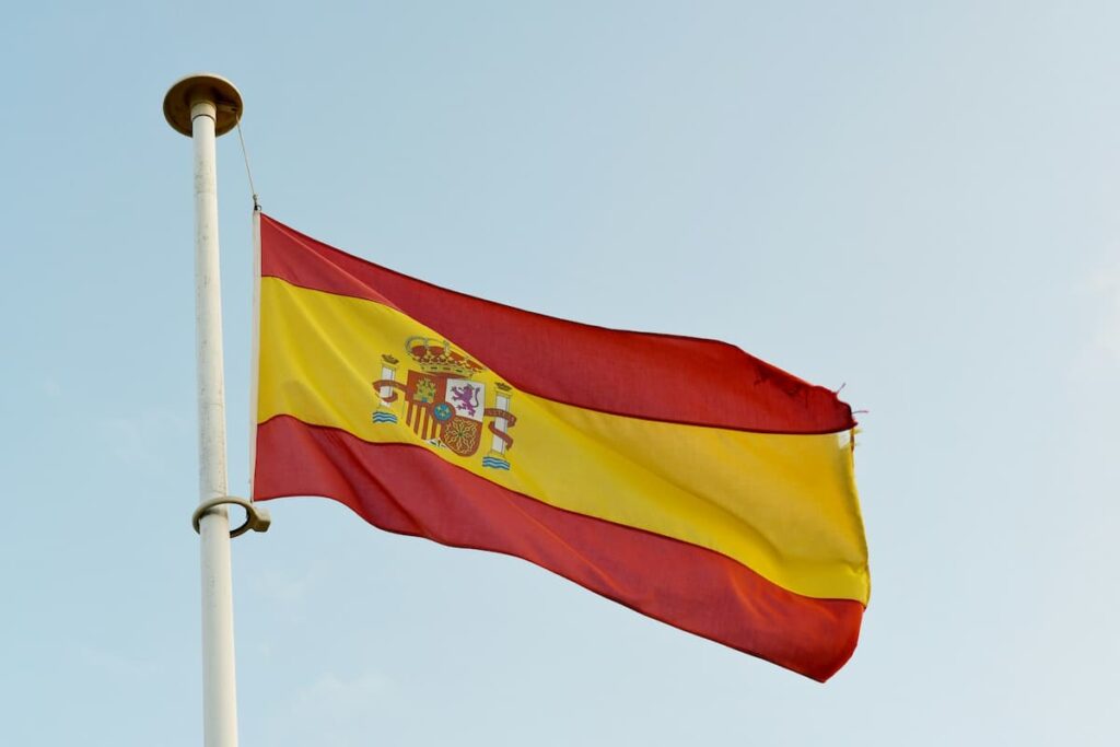 Spanish flag on a pole in sky