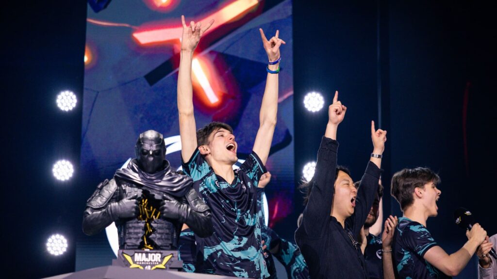 Rainbow Six Siege BLAST R6 Munich Major team celebrating victory on stage beside the event trophy