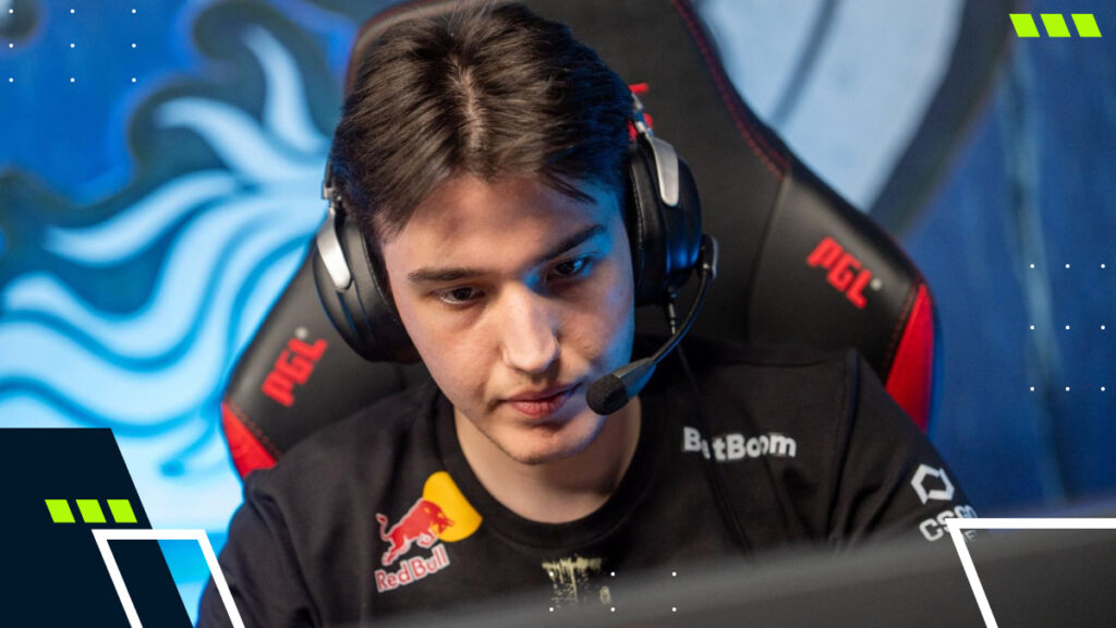 A focused young man wearing a headset sits in a gaming chair, intently looking at a screen