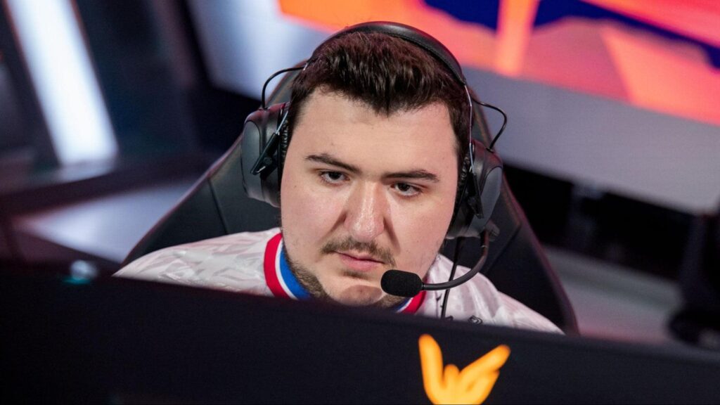 An esports competitor Kadir "Fleshy" Kemiksiz focuses on his monitor during a live tournament.