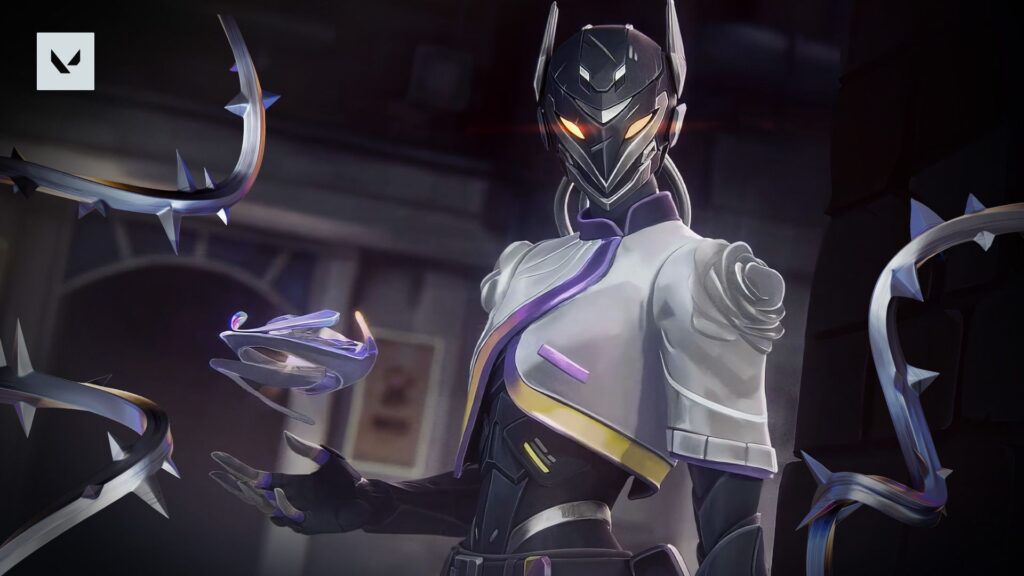 A VALORANT agent with glowing eyes stands surrounded by sharp metallic vines. The character holds floating shards with a calm but powerful presence