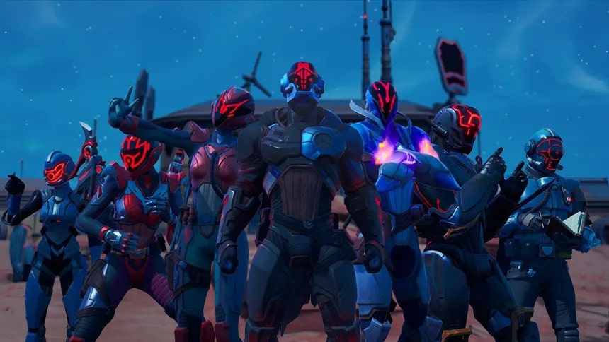 Group shot of armored Fortnite characters with glowing red and blue visors standing together in a desert outpost in Fortnite Chapter 7