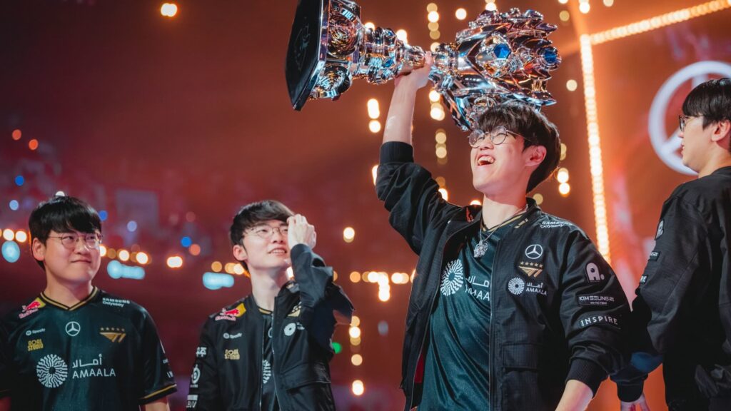 A player lifts the trophy on stage as the Esports Team celebrates a major tournament win