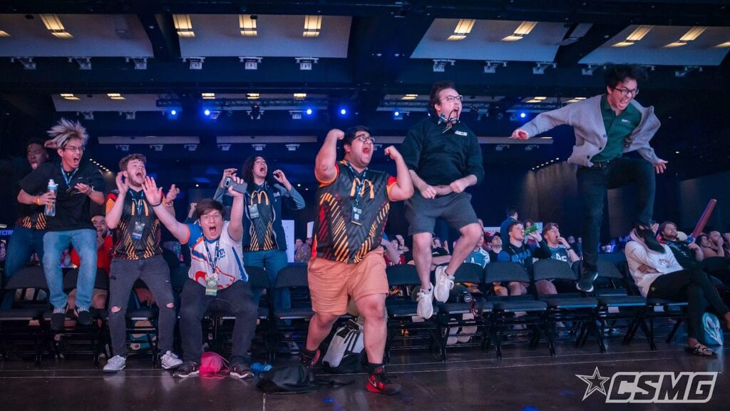 Live esports audience celebrating during a major tournament match at a packed competitive gaming event