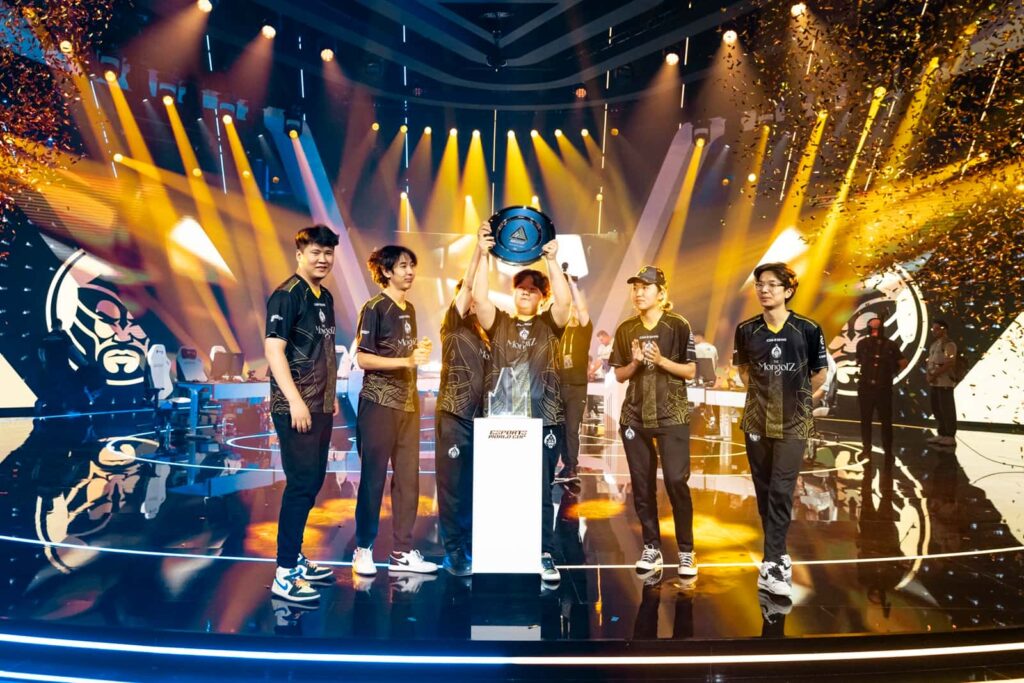 The MongolZ celebrate their Esports World Cup 2025 victory on stage