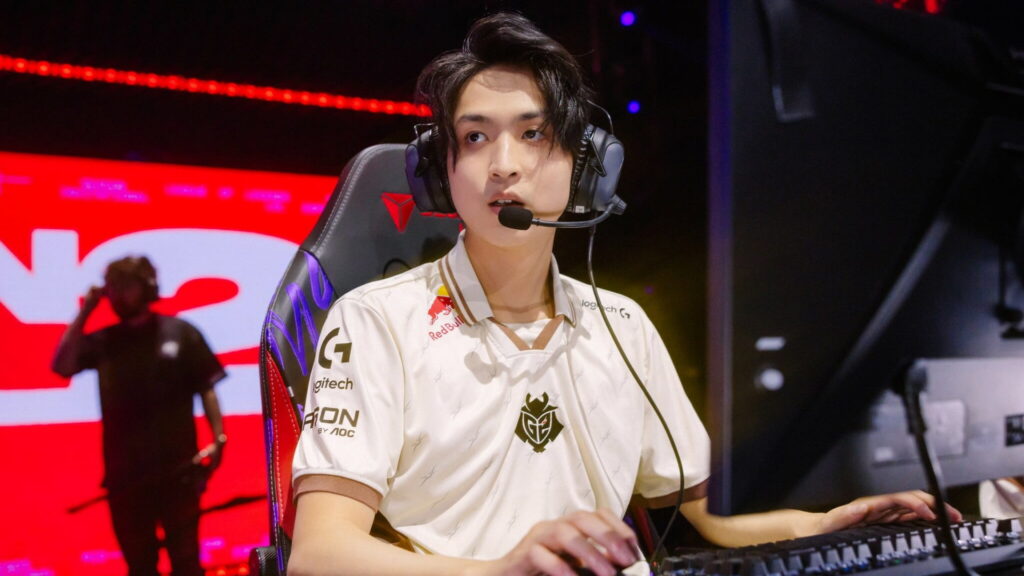 Professional League of Legends ADC competing on stage during a high-level tournament match