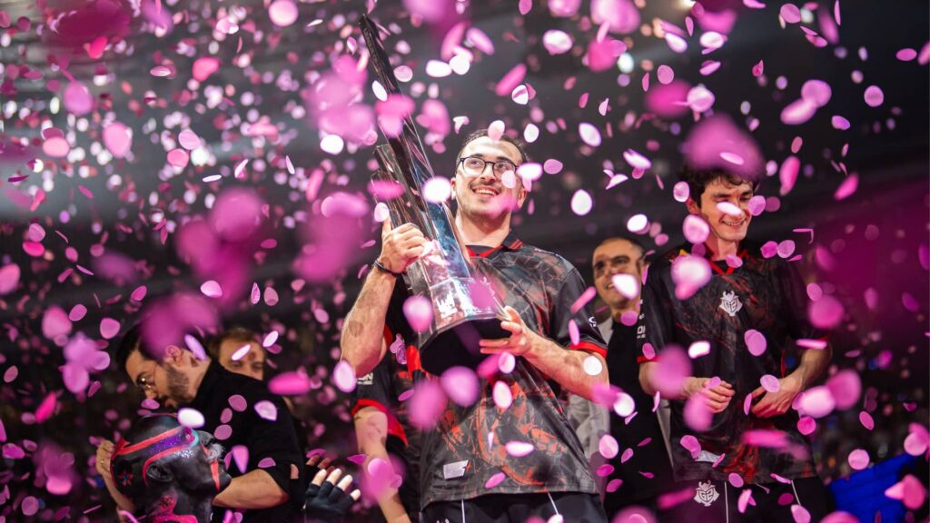 Players celebrate a tournament victory with confetti and a trophy during the 2025 League of Legends season