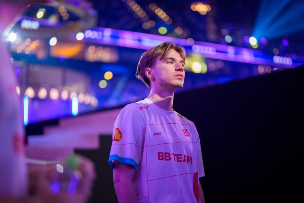 Ivan "Pure" Moskalenko on stage competing for BetBoom Team at a Dota 2 LAN event