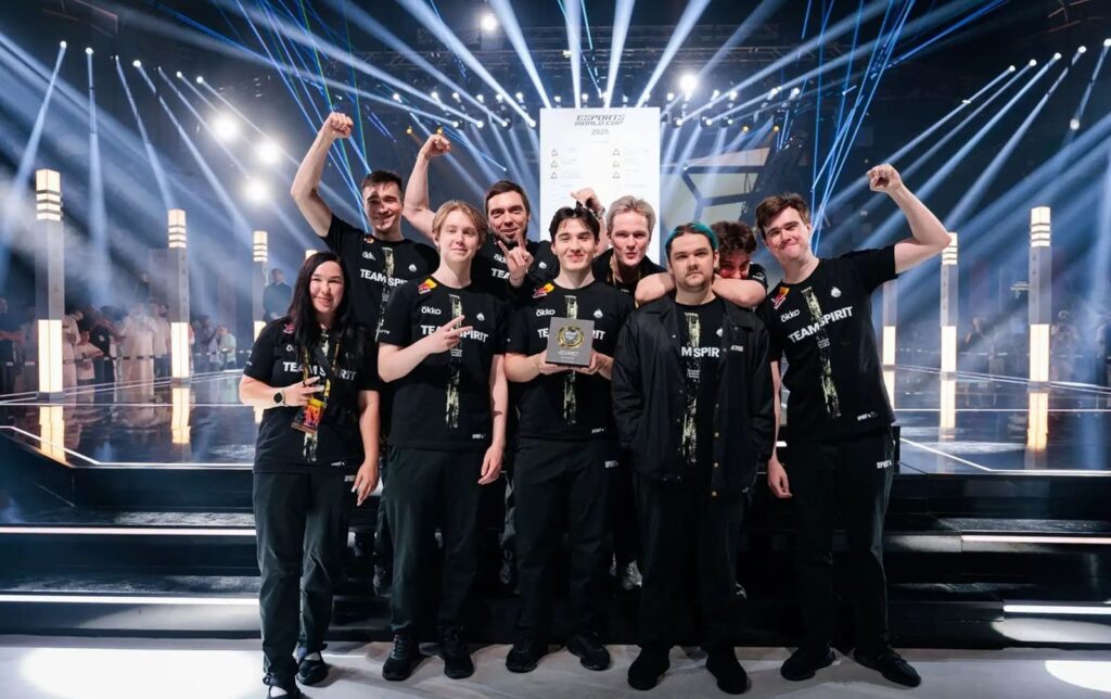 Team Spirit pose with their award after a Dota 2 esports victory