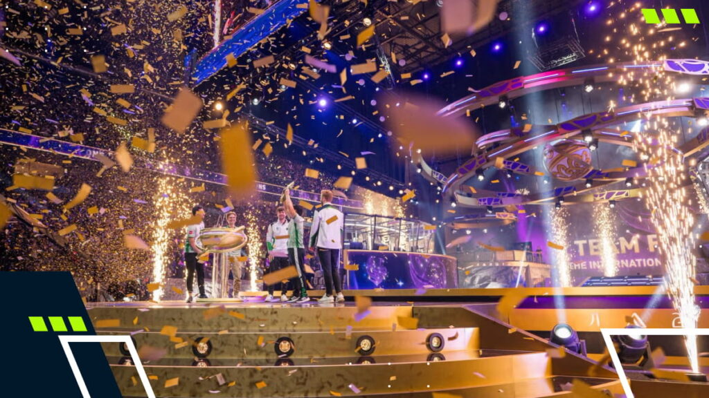 Confetti and fireworks surround players celebrating a championship win at a Dota 2 The International event