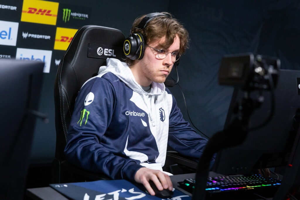 A Team Liquid offlaner maintaining focus during a competitive Dota 2 match on stage