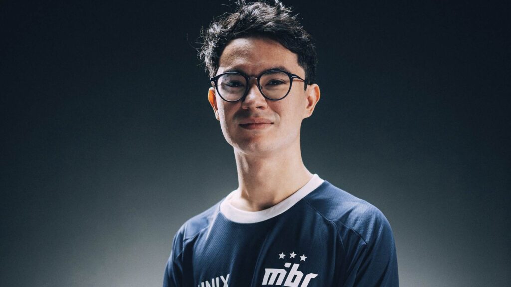 A studio portrait of a VALORANT esports player wearing a dark blue MBC Esports jersey.