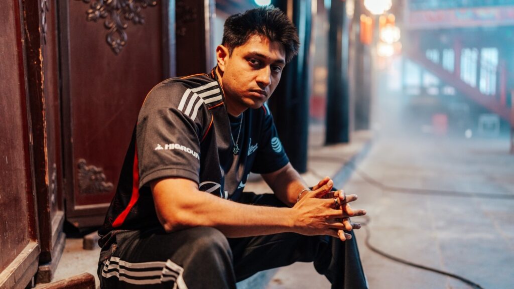 Dhokla posing in 100 Thieves jersey