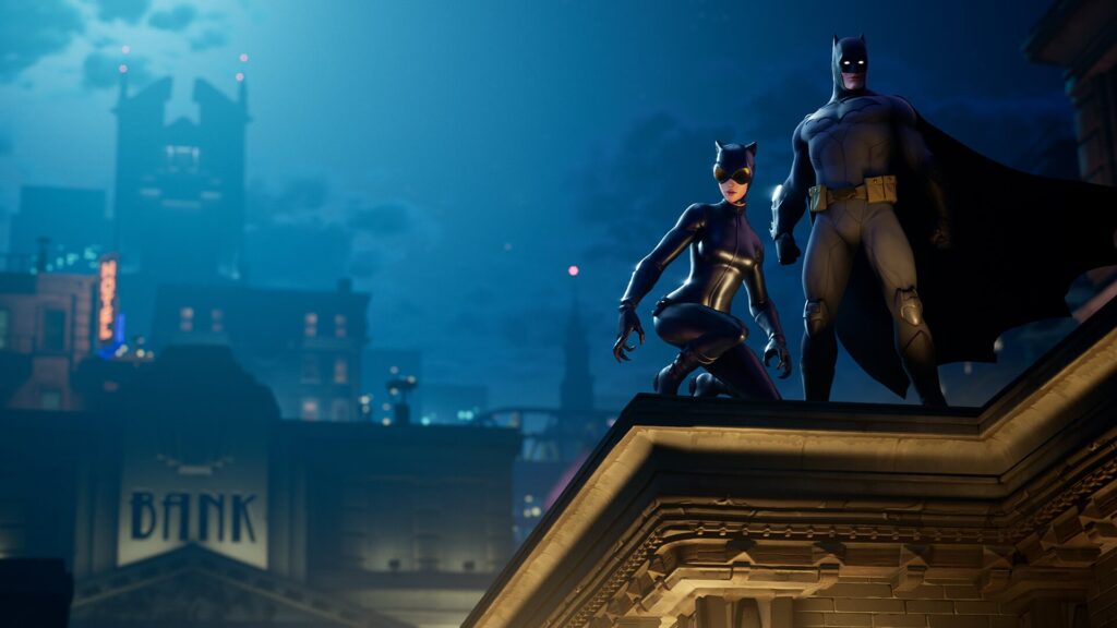 Batman and Catwoman stand on a rooftop overlooking the city during a Fortnite crossover scene