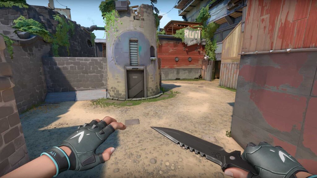 First-person attacker view entering B Site on Breeze, highlighting tight entry angles, cover positions, and split options via Elbow.