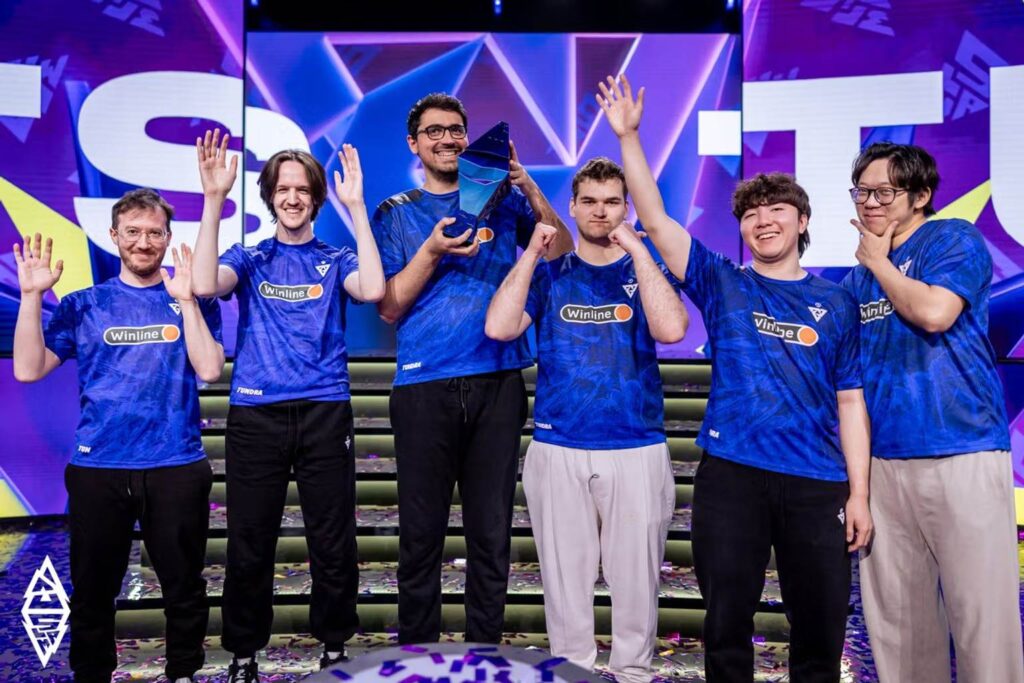 Tundra Esports players celebrating on stage after a BLAST Slam victory, one team chasing a fifth title at BLAST Slam VI.