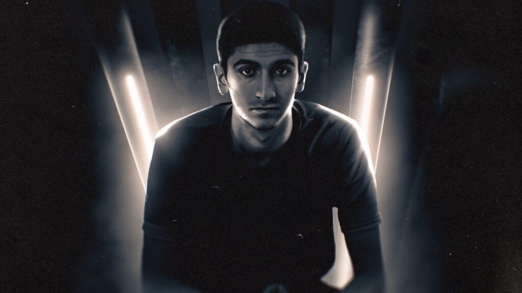 Fortnite professional player posing in a dramatic black-and-white studio portrait with backlighting